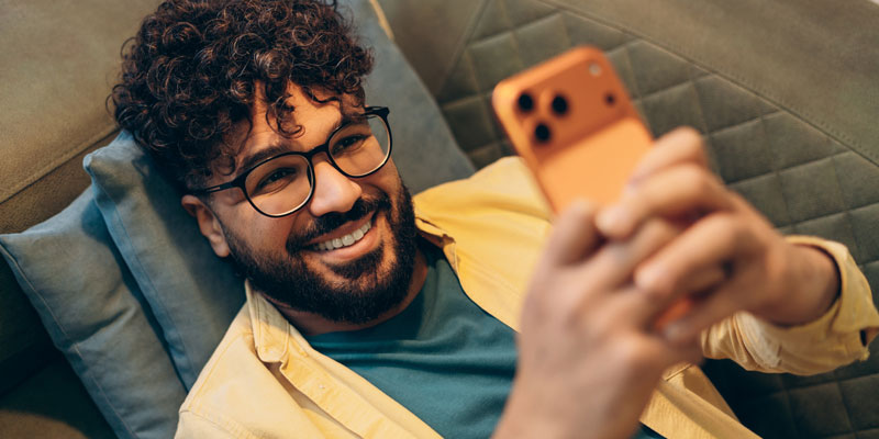 smiling man with phone